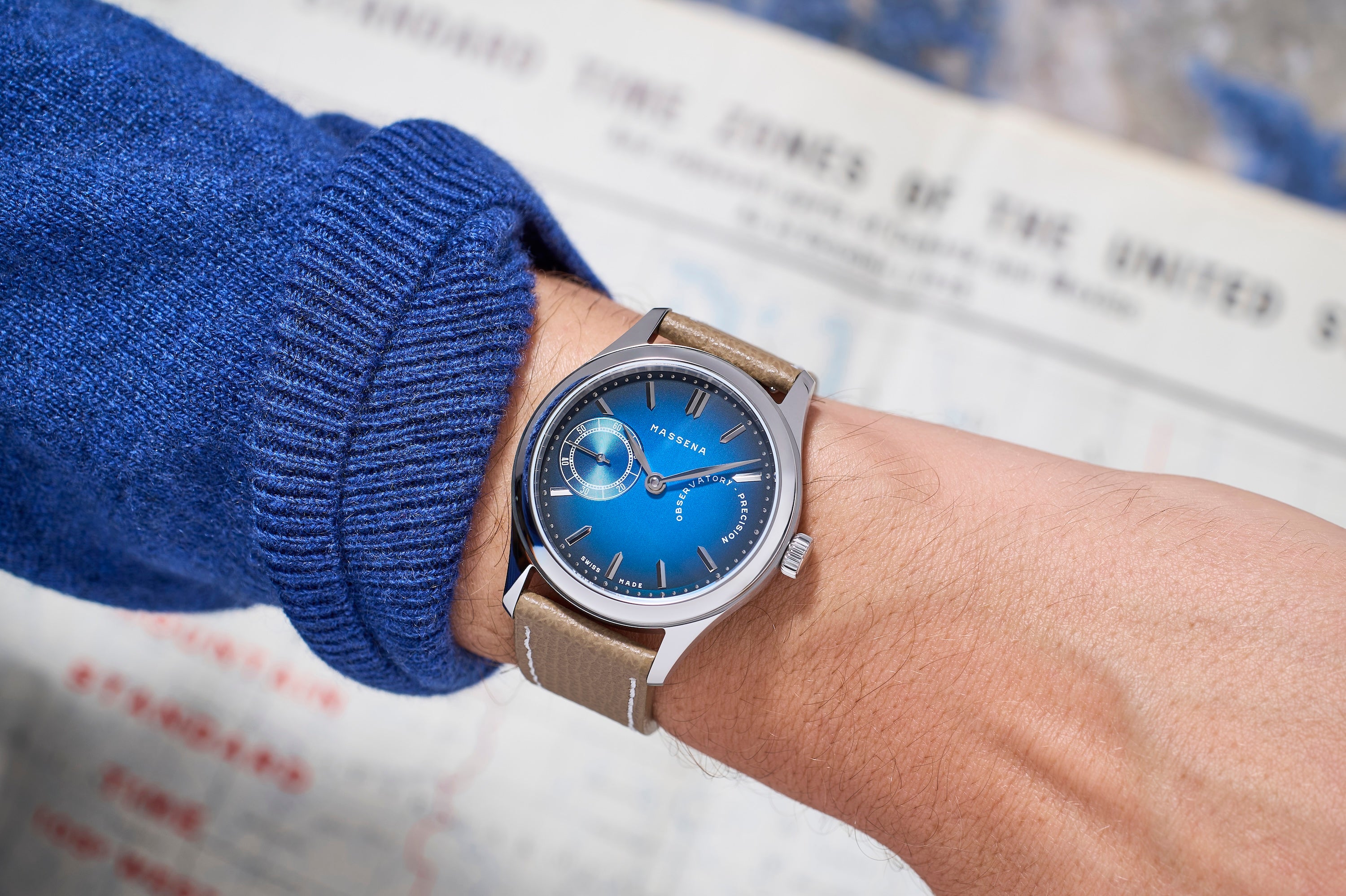 The TZ30 by Massena LAB and Raúl Pagès limited edition wristwatch worn on the wrist paired with a blue sweater 