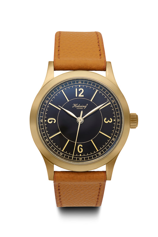 On its dial, the Massena LAB x Habring² ERWIN LAB01 is a simple, three hand timepiece with a deep black sector dial.