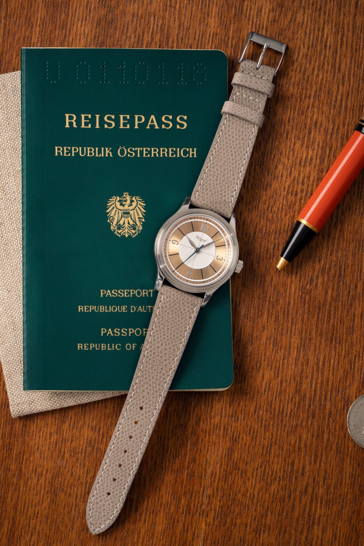 On its dial, the Massena LAB x Habring² ERWIN LAB02 is a simple, three-hand timepiece with a contrast silver and rose gold sector dial.